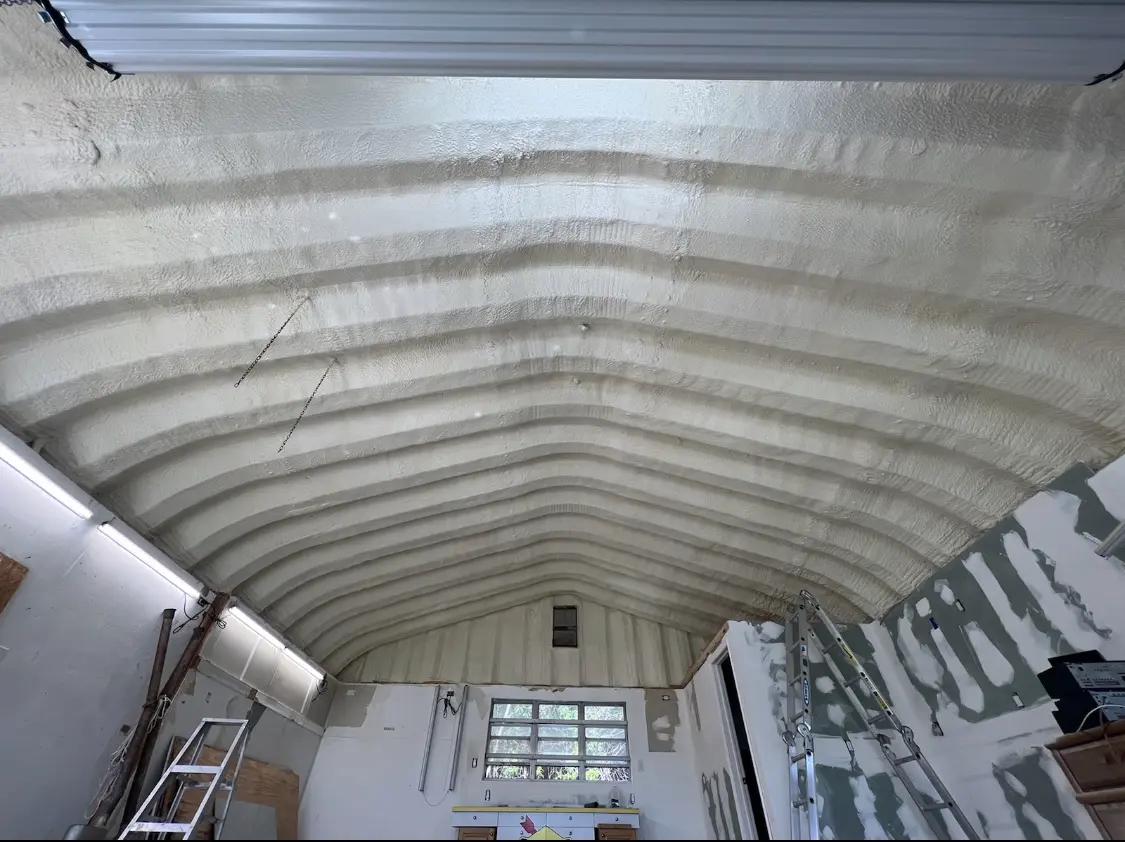 Spray polyurethane foam applied to the underside of a metal roof deck in Dayton